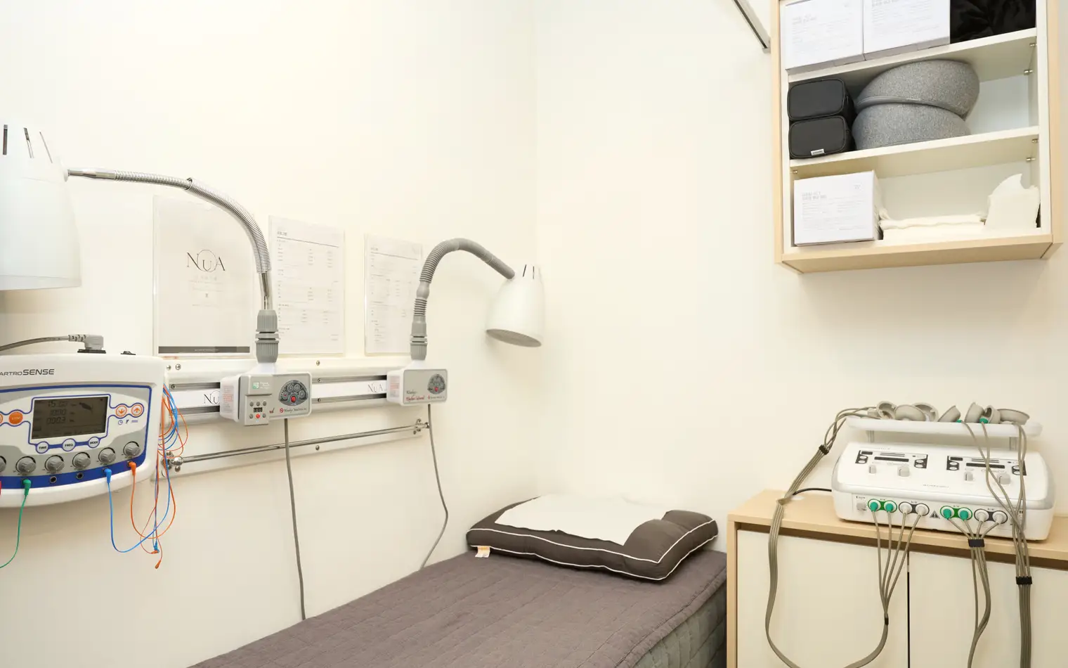 NuA Korean Medicine Clinic treatment room with physical therapy equipment ready