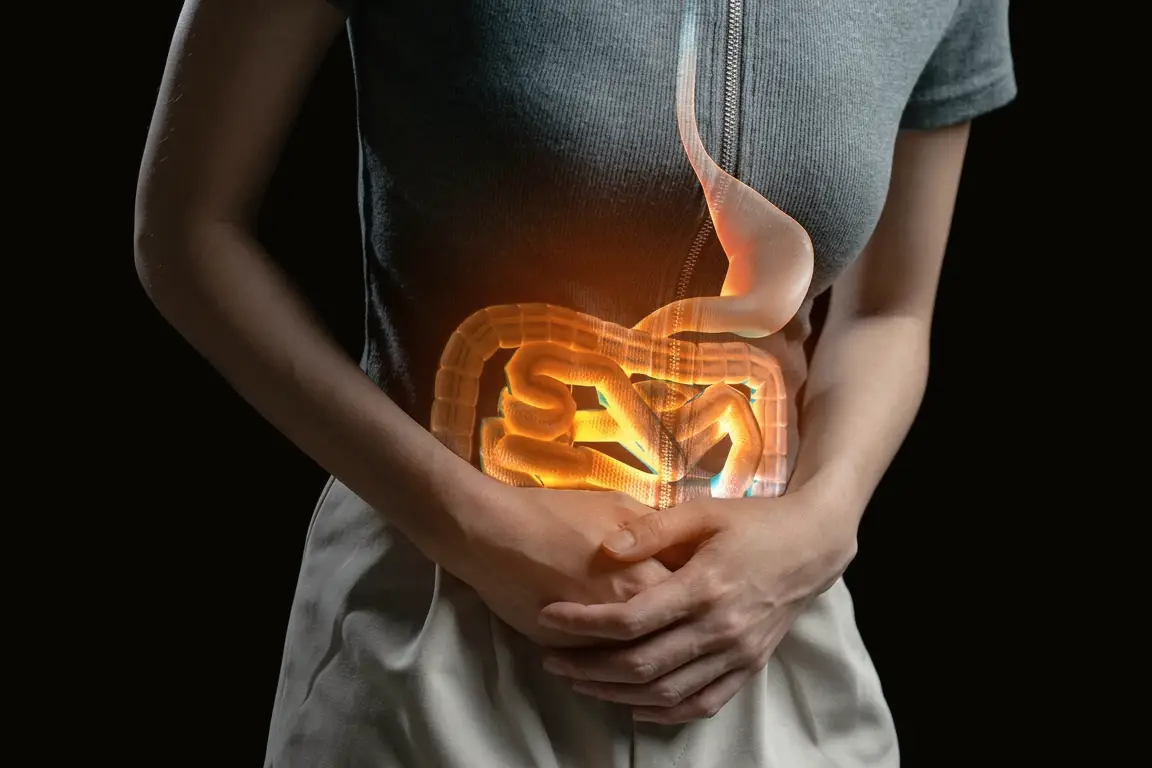 Hands over the abdomen overlaid with an illustration of the stomach and intestines